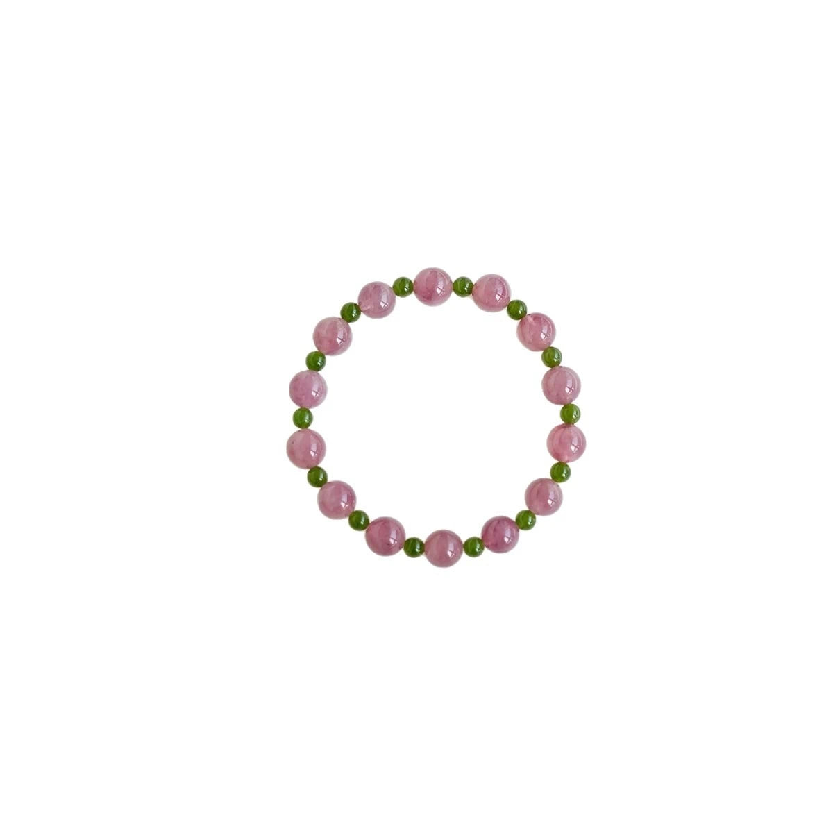 Womans hand wearing a pink crystal and green jade beaded bracelet in modern chinese style