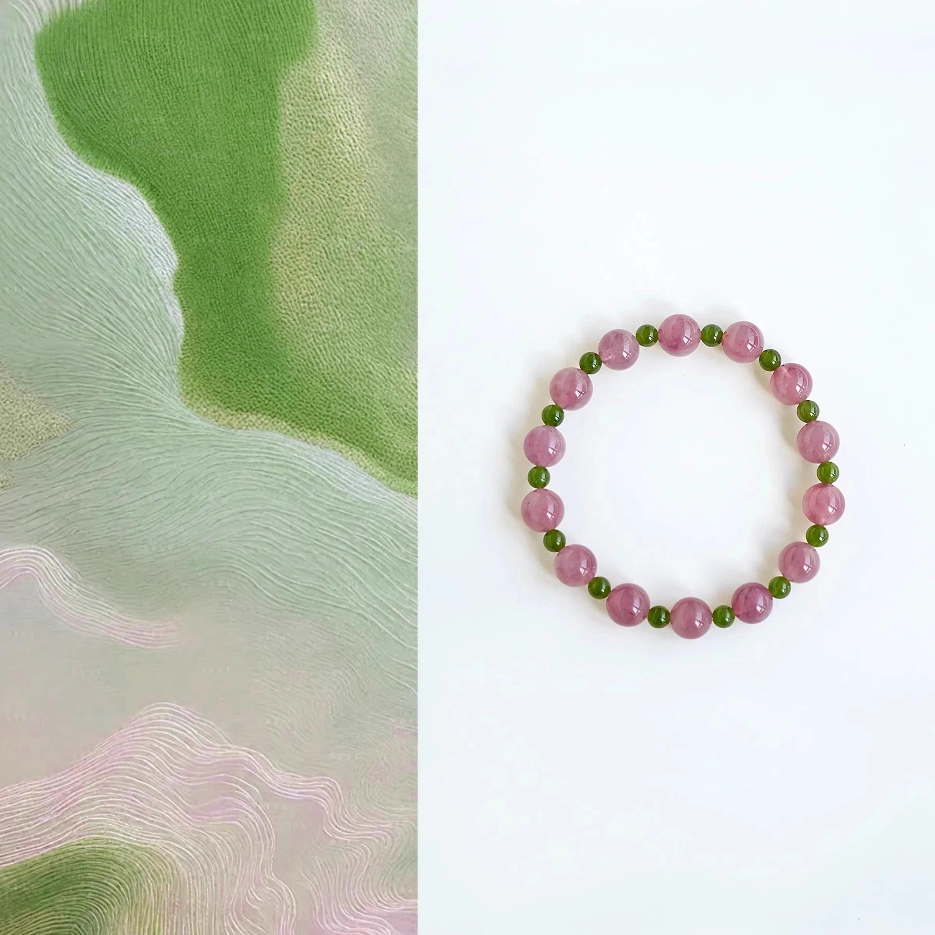 Womans hand wearing a pink crystal and green jade beaded bracelet in modern chinese style